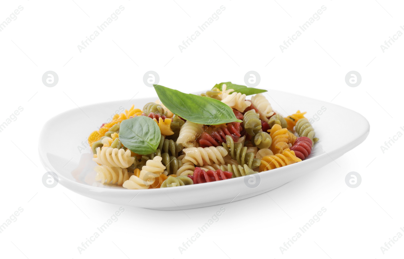 Photo of Delicious vegetable spiraline pasta with basil isolated on white