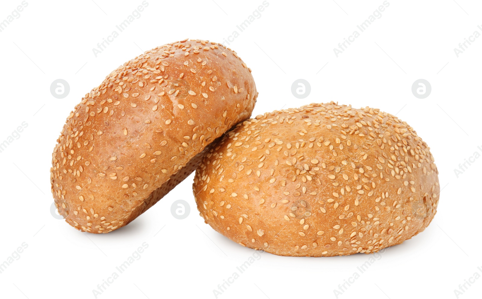 Photo of Two fresh hamburger buns with sesame seeds isolated on white