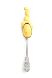 Photo of Delicious cheese sauce and spoon on white background, top view