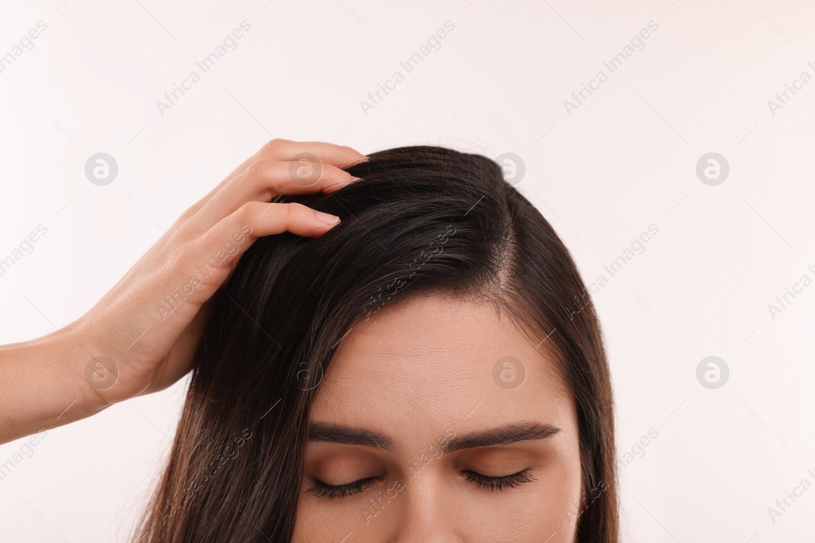 Photo of Woman with healthy hair on white background, closeup