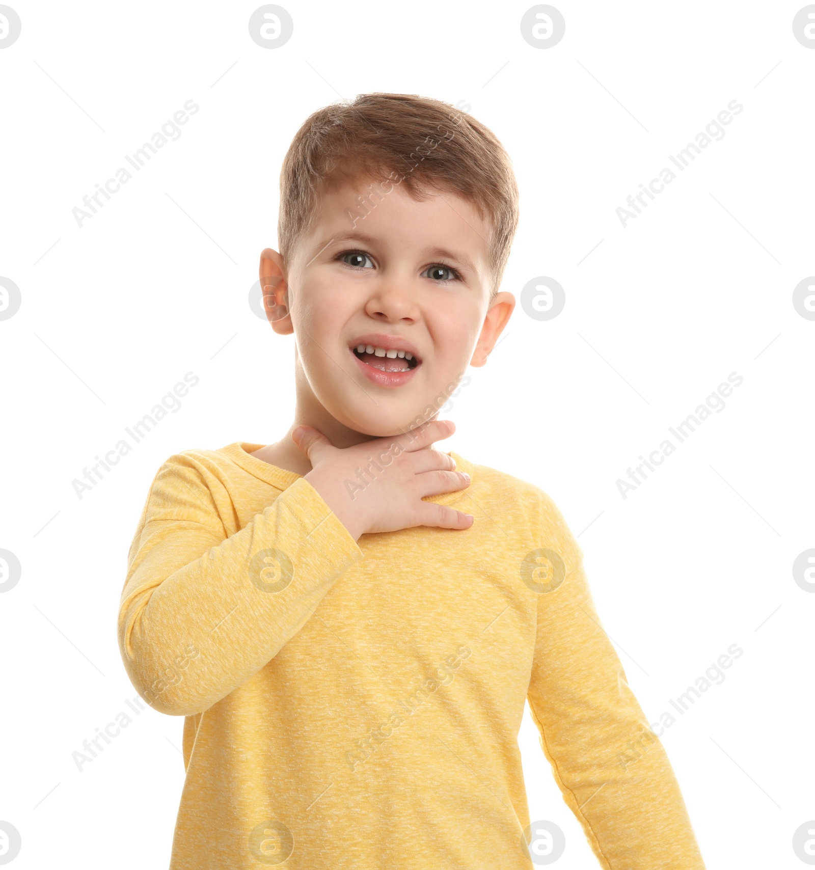 Photo of Cute boy suffering from cough on white background