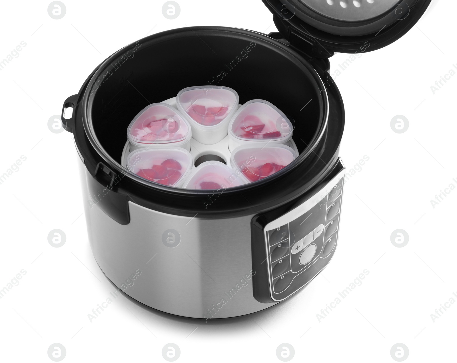 Photo of Open multi cooker with cups of homemade yogurt isolated on white