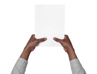 Photo of African American man holding sheet of paper on white background, closeup. Mockup for design
