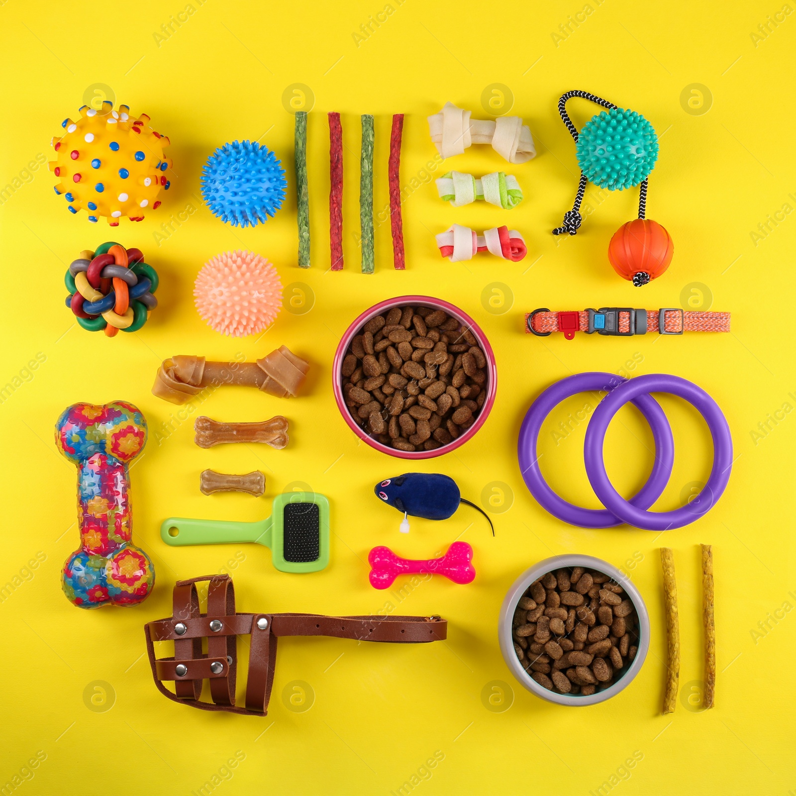 Photo of Flat lay composition with different pet goods on yellow background. Shop assortment