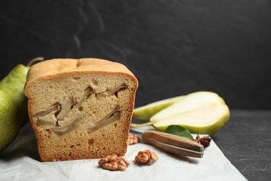 Photo of Tasty cut pear bread on table. Homemade cake