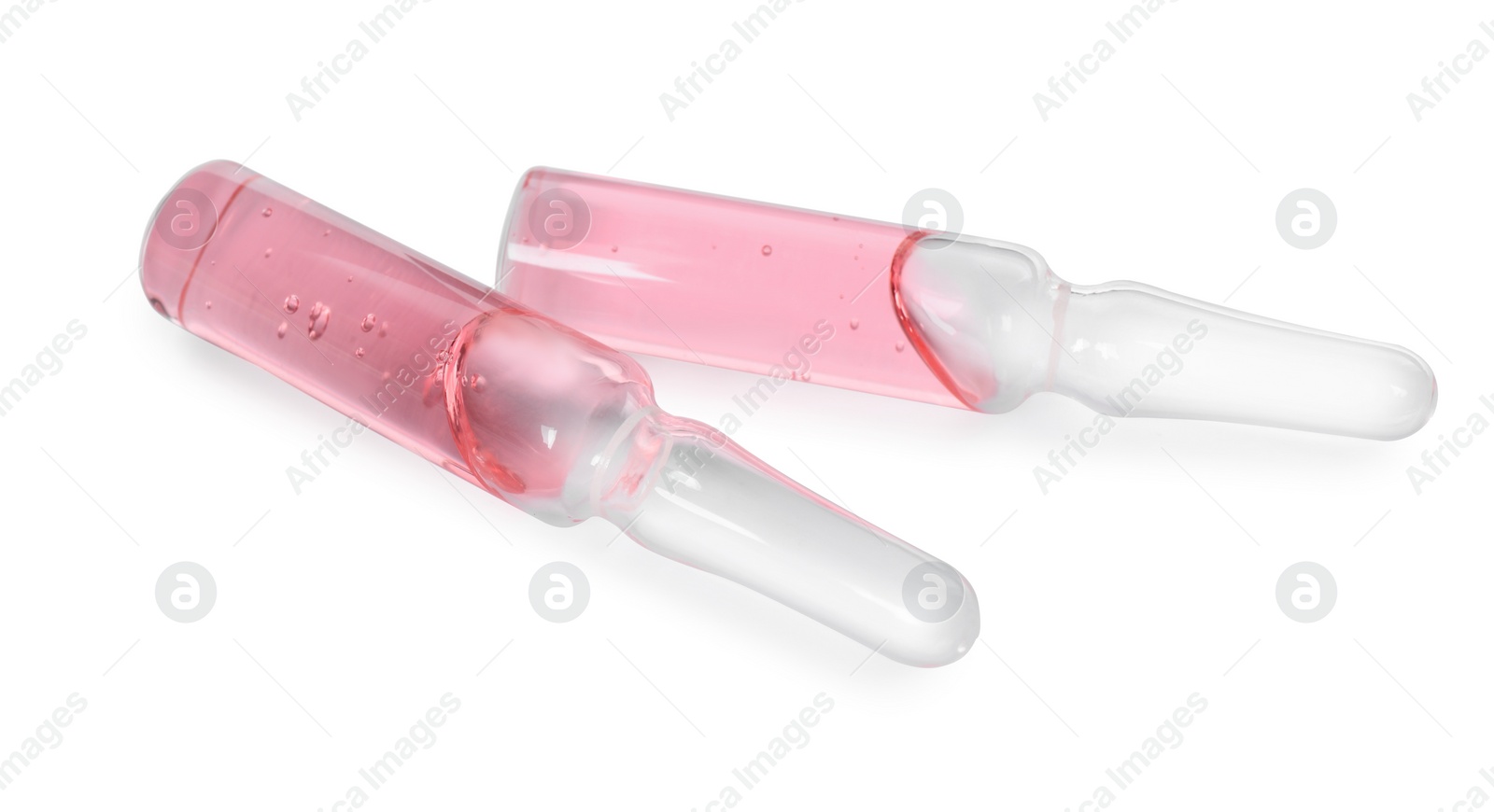 Photo of Glass ampoules with pharmaceutical product on white background