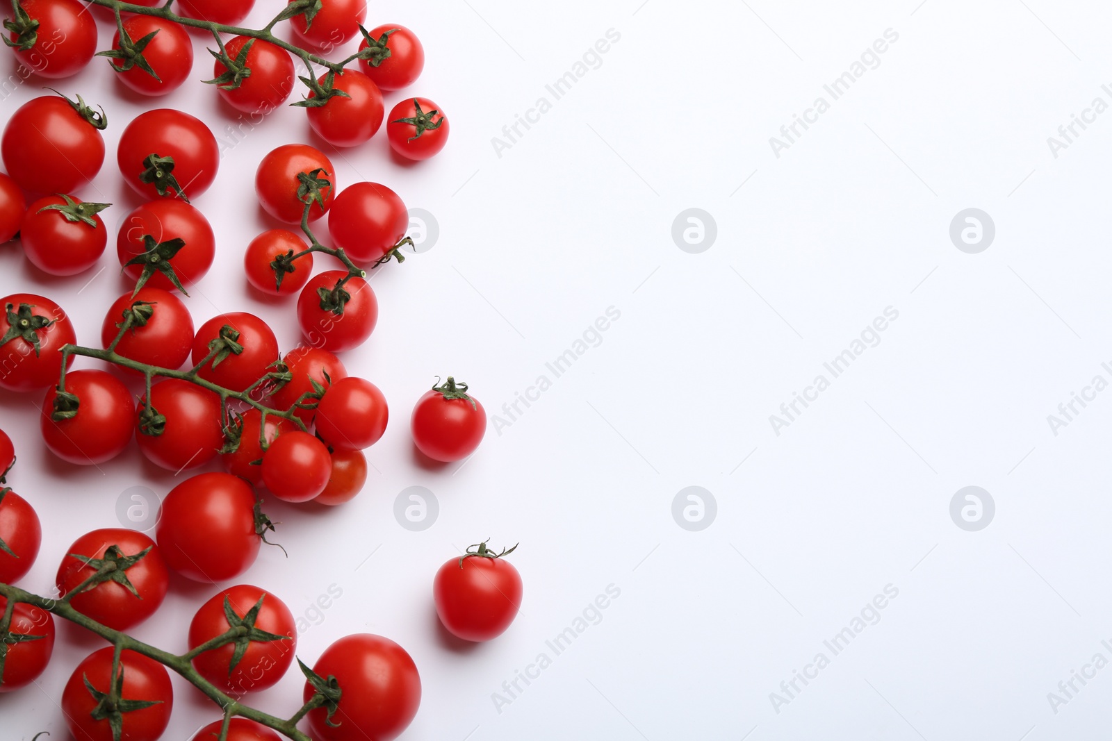 Photo of Fresh cherry tomatoes on white background, top view