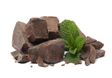 Photo of Tasty dark chocolate pieces with mint on white background