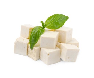 Photo of Delicious tofu cheese and basil isolated on white