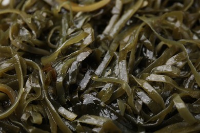 Photo of Tasty seaweed salad as background, closeup view