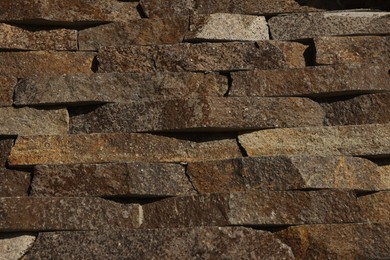 Photo of Texture of brown brick wall as background