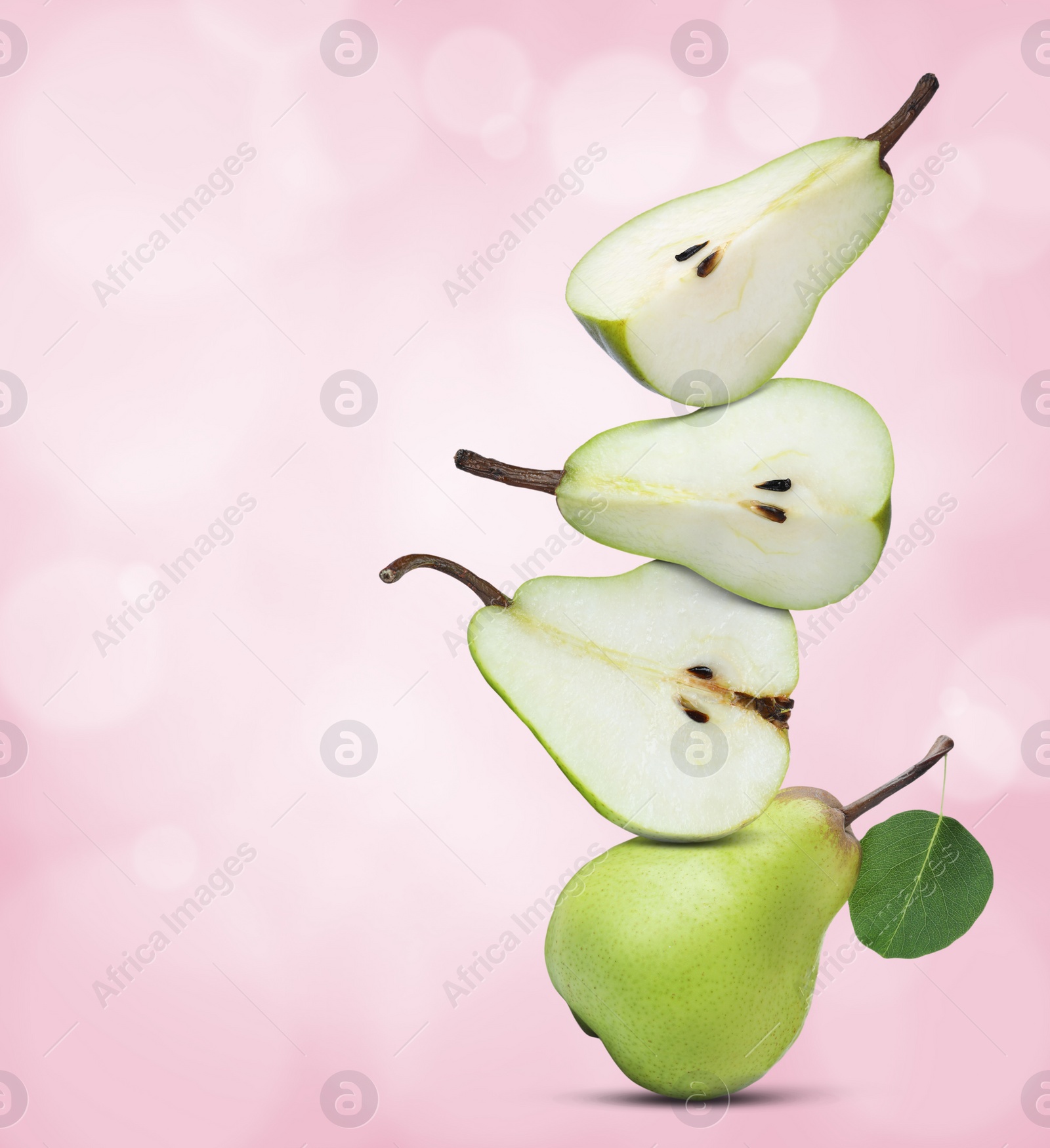 Image of Cut and whole fresh ripe pears on pink gradient background, space for text