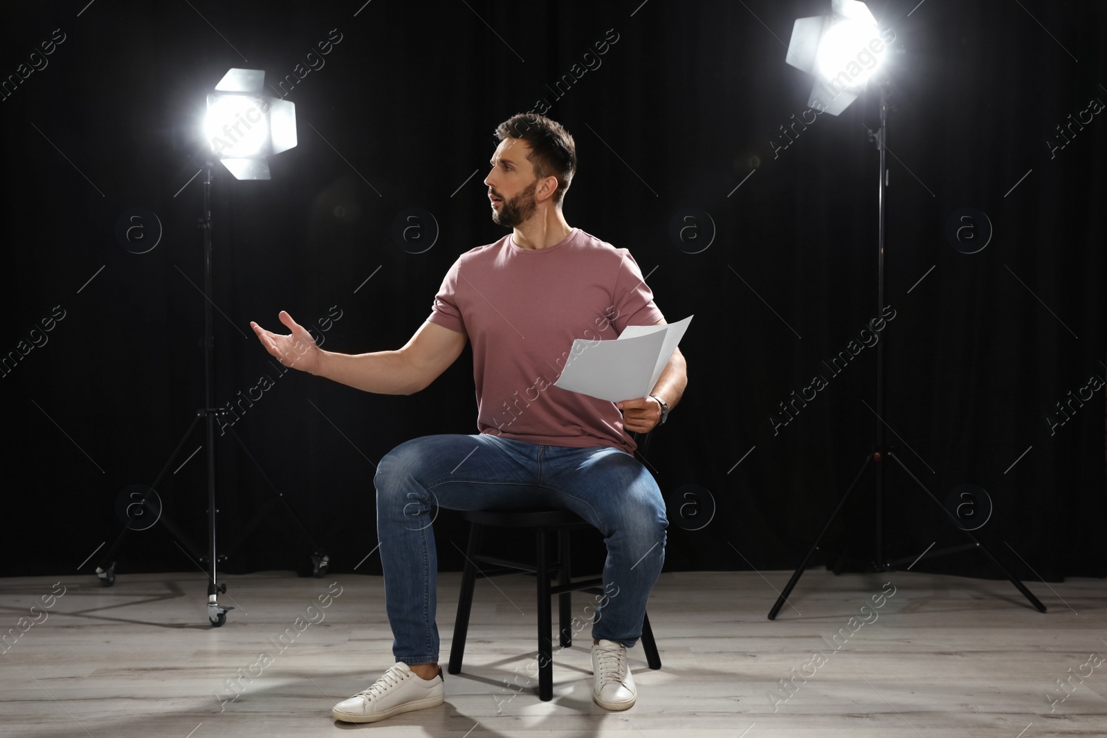 Photo of Professional actor rehearsing on stage in theatre