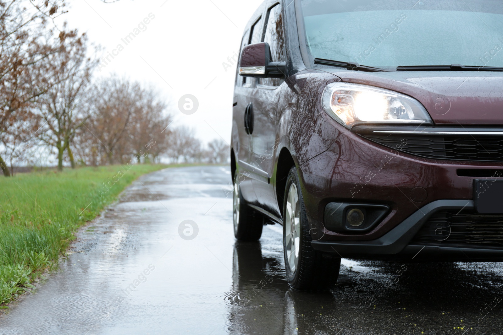 Photo of Car parked outdoors on rainy day