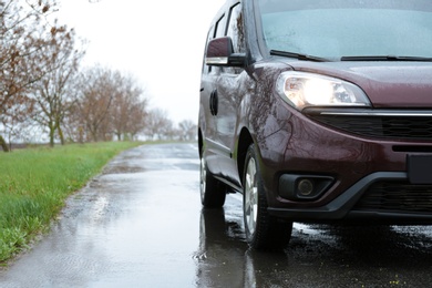 Photo of Car parked outdoors on rainy day