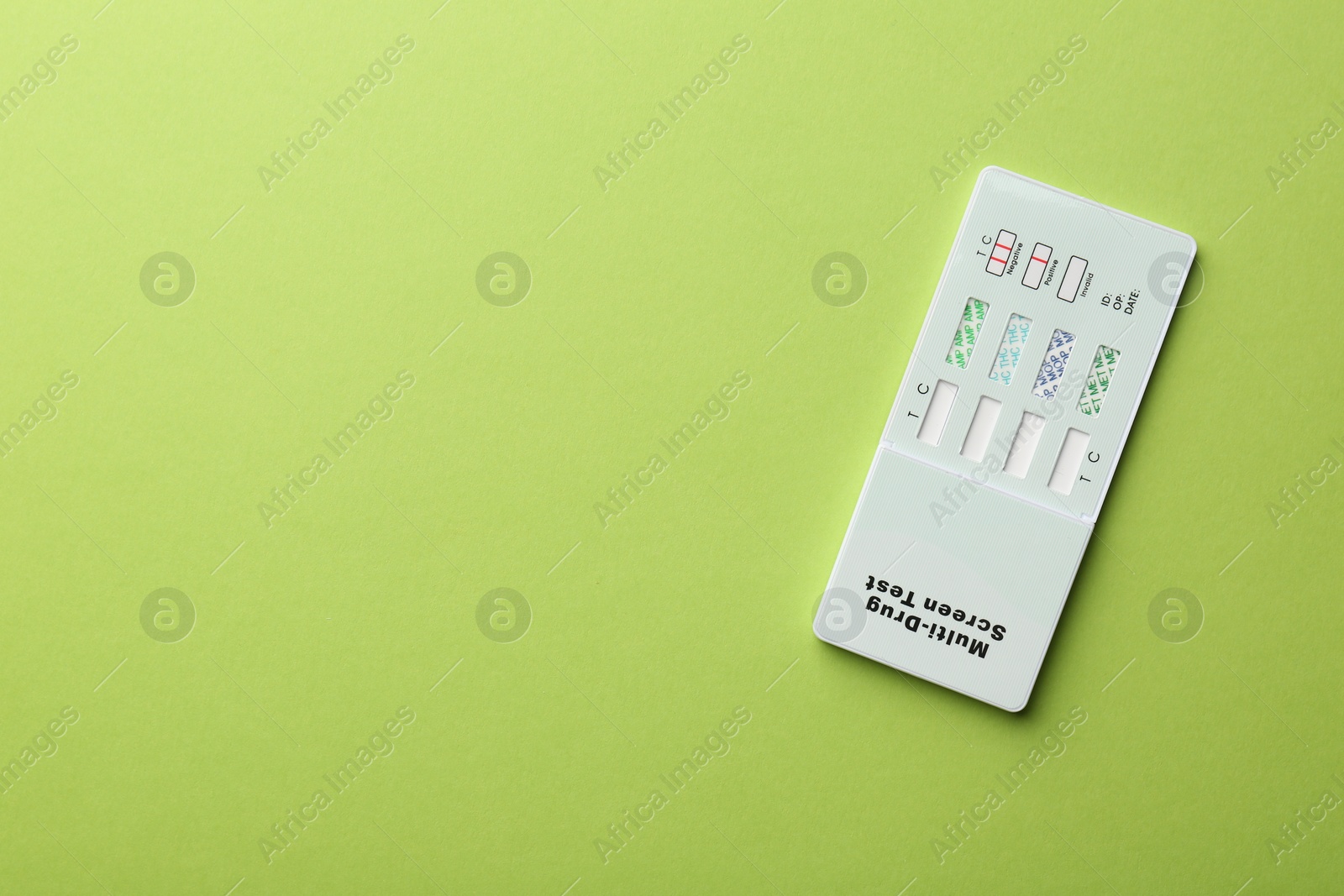 Photo of Multi-drug screen test on light green background, top view. Space for text