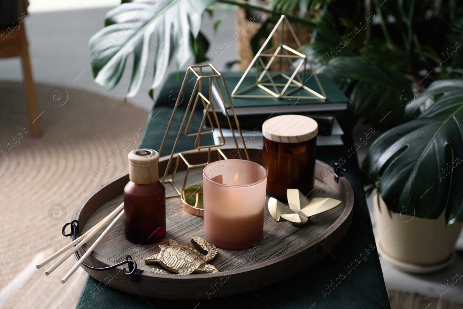 Photo of Wooden tray with decorations on bench indoors