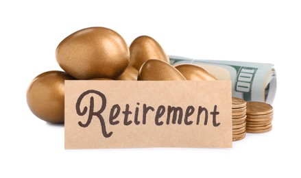 Photo of Many golden eggs, money and card with word Retirement on white background. Pension concept
