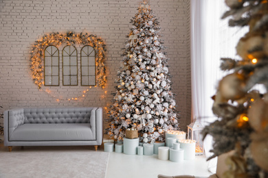 Photo of Beautiful interior of living room with decorated Christmas trees