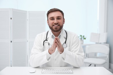 Photo of Pediatrician consulting patient using video chat in clinic, view from webcam