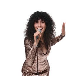 Beautiful young woman with microphone singing on white background