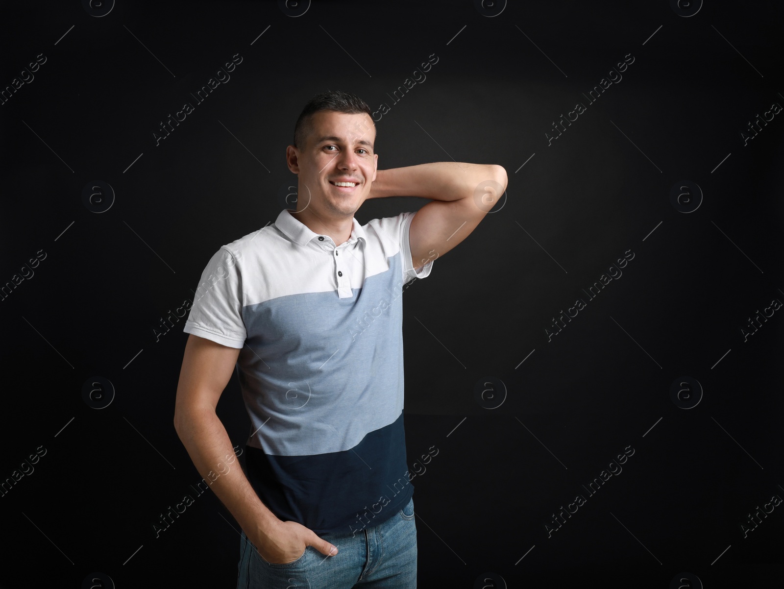 Photo of Portrait of handsome man on black background