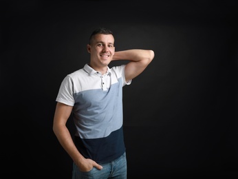 Portrait of handsome man on black background