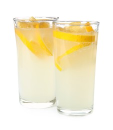Photo of Refreshing lemonade in glasses on white background