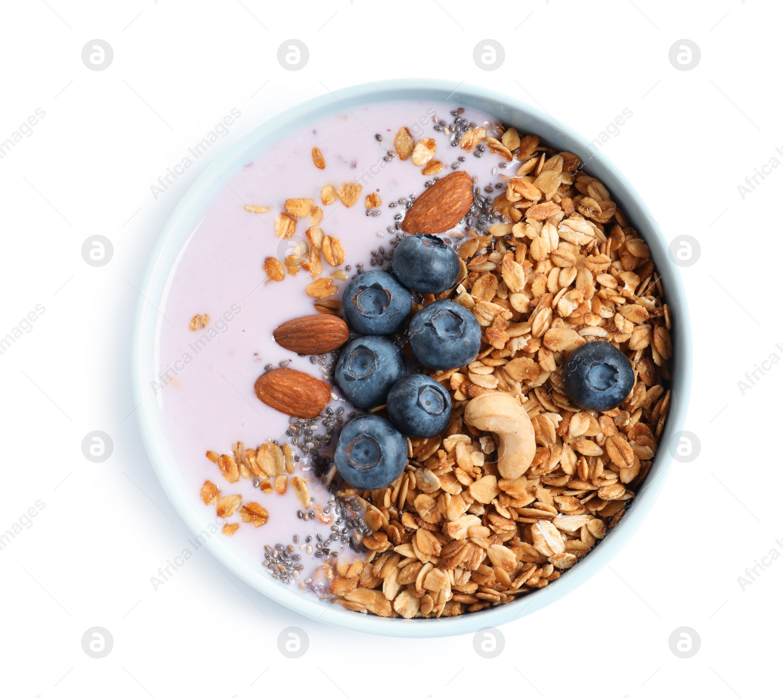 Photo of Bowl of tasty yogurt with blueberries and oatmeal on white background, top view