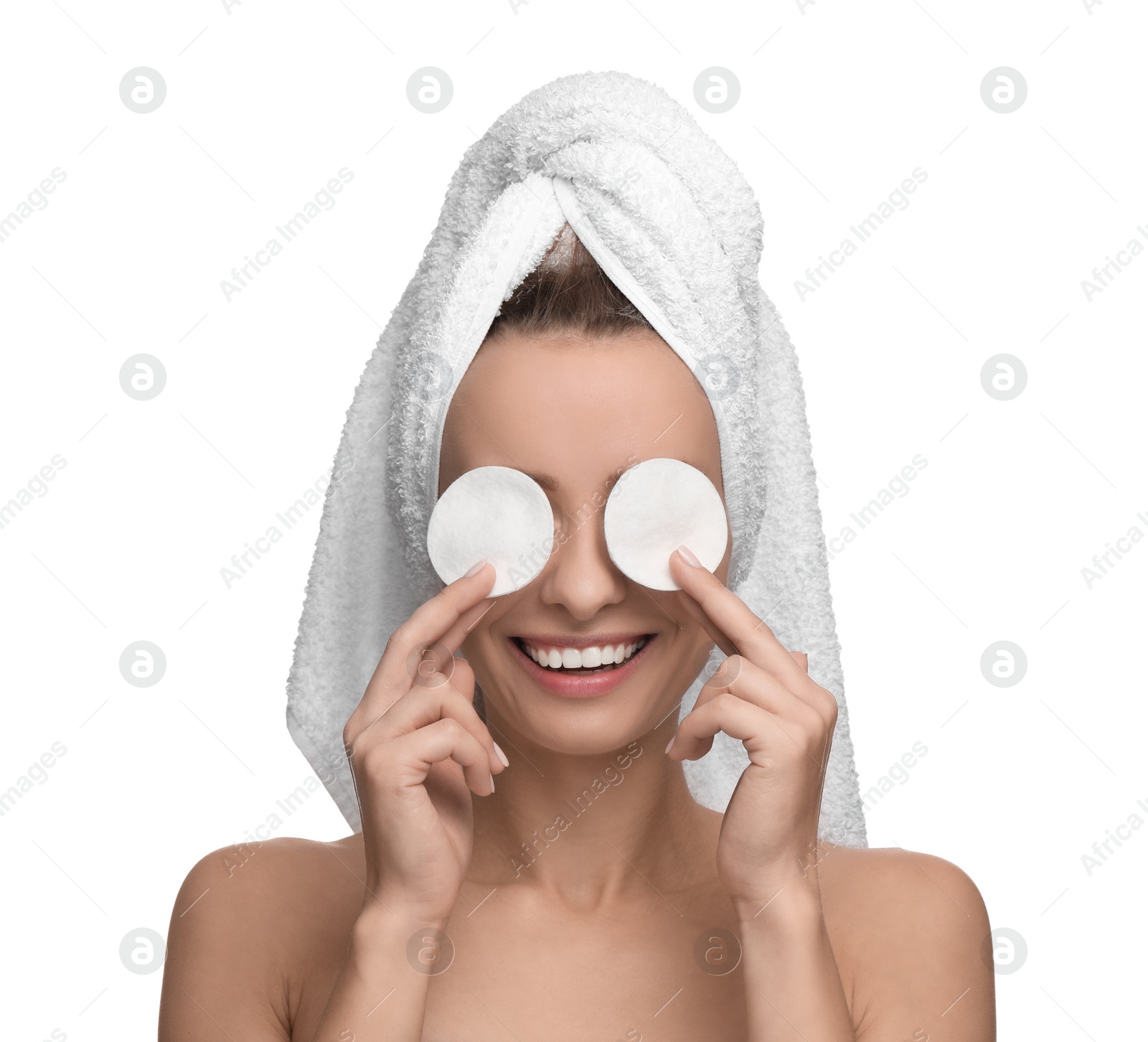 Photo of Smiling woman removing makeup with cotton pads on white background