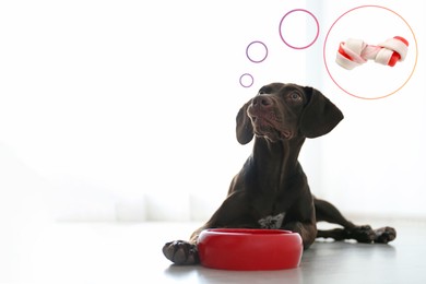 Image of Cute German Shorthaired Pointer dog near feeding bowl dreaming about tasty treat indoors, space for text. Thought bubble with knotted bone