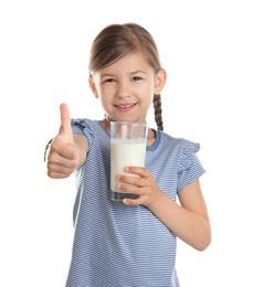 Cute little girl with glass of milk on white background