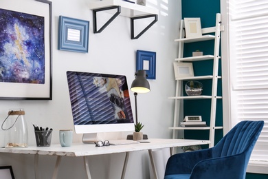 Photo of Home workplace with modern computer and desk in room