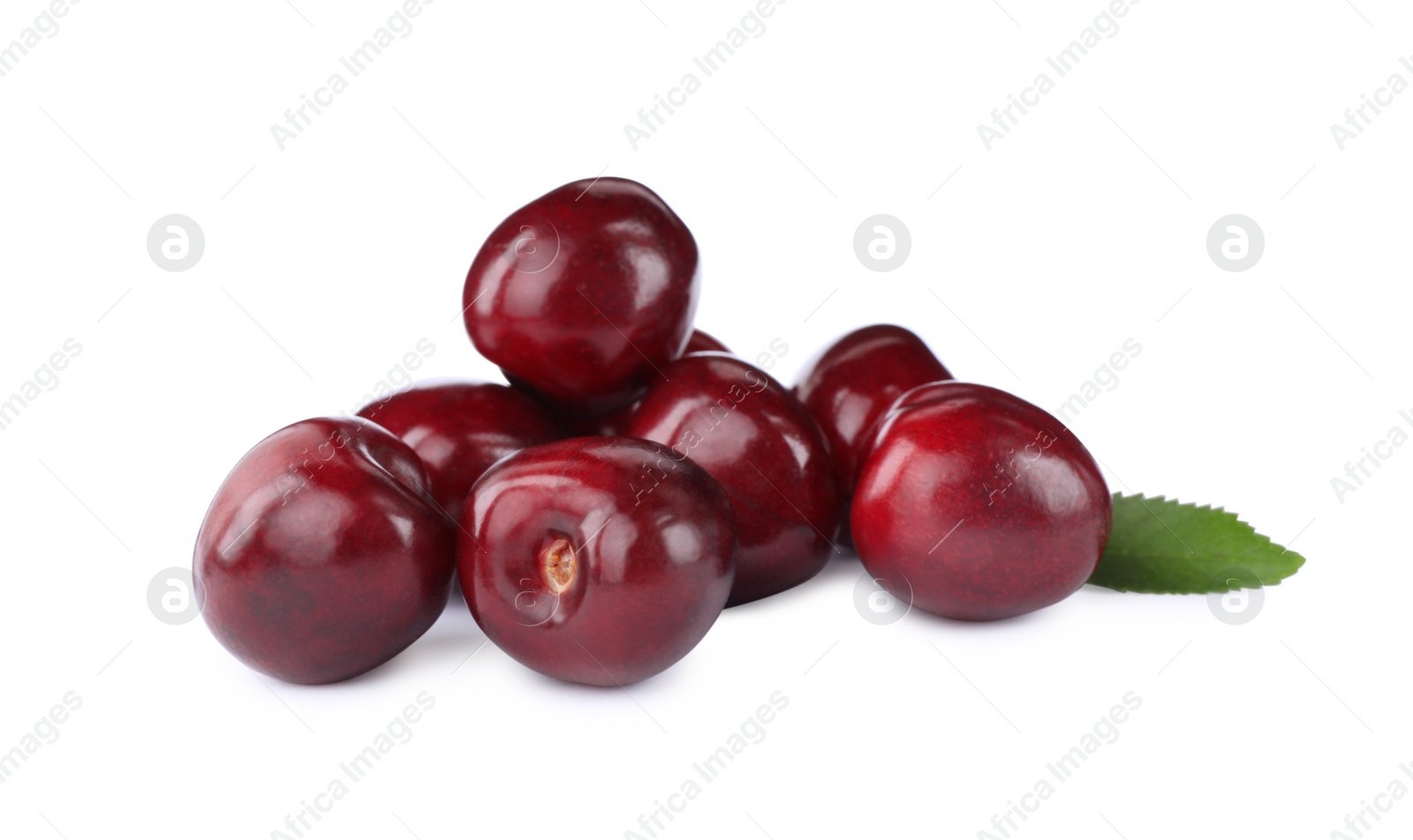 Photo of Tasty ripe red cherries with green leaf isolated on white