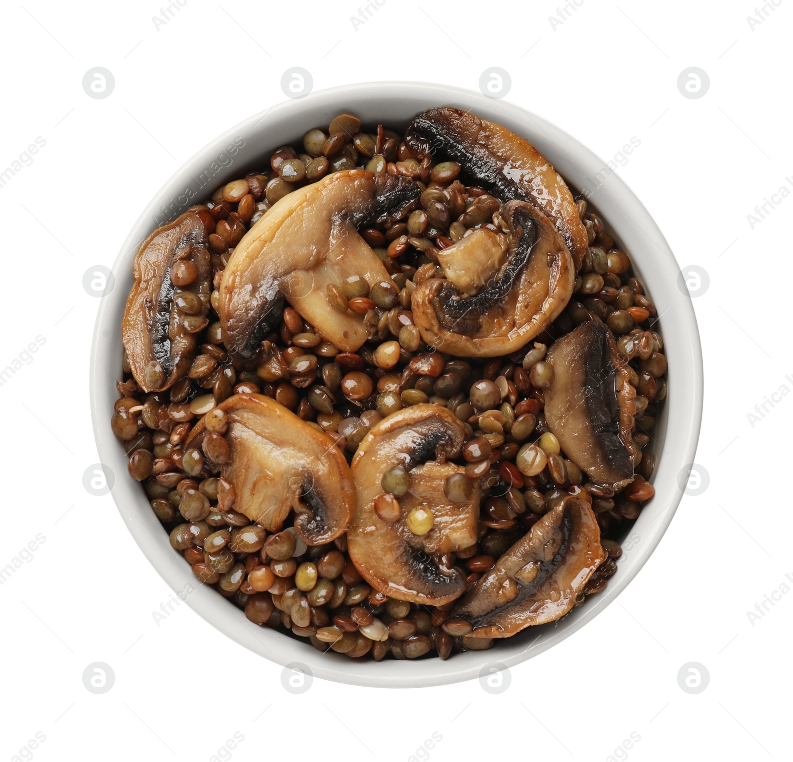 Photo of Delicious lentils with mushrooms in bowl isolated on white, top view