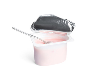 Tasty organic yogurt in plastic cup with spoon isolated on white