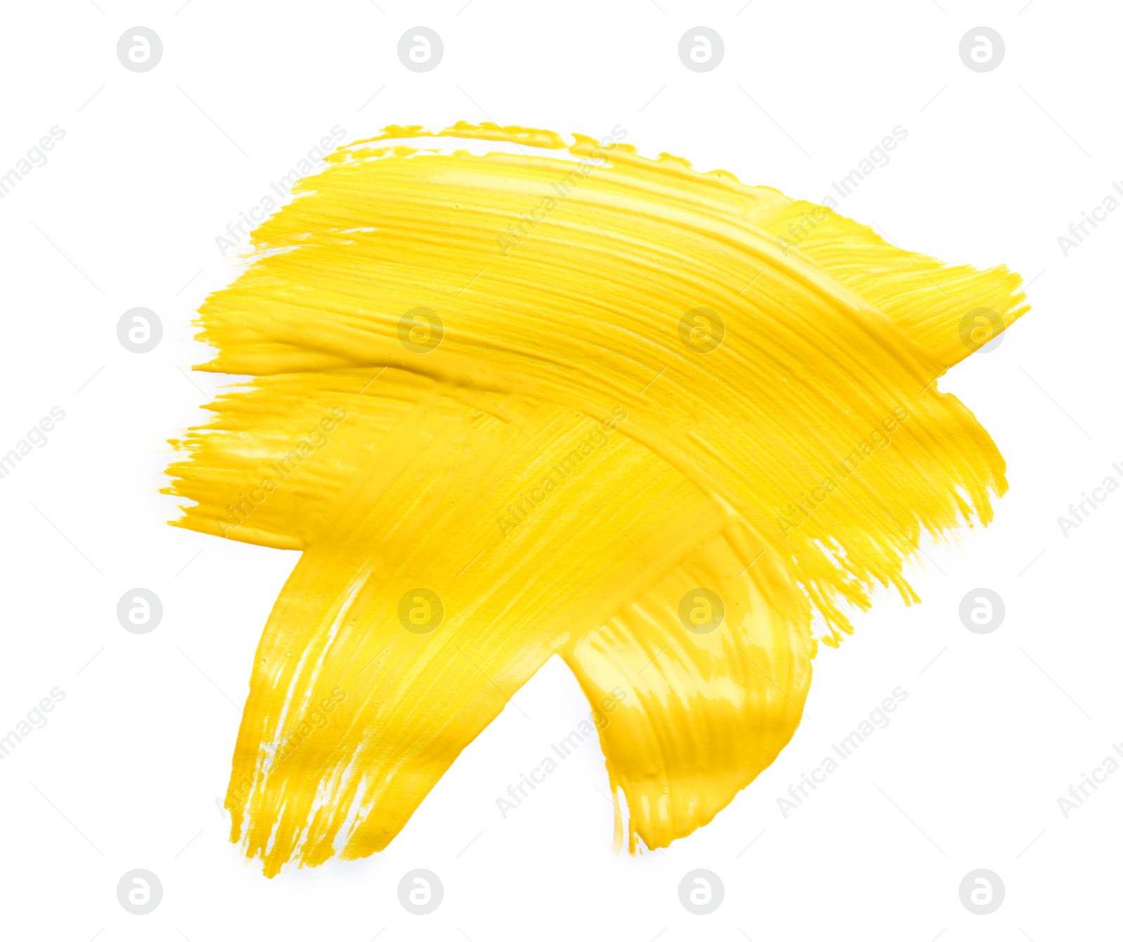 Photo of Abstract brushstroke of yellow paint isolated on white