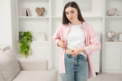 Photo of Diabetes. Woman making insulin injection into her belly at home, space for text