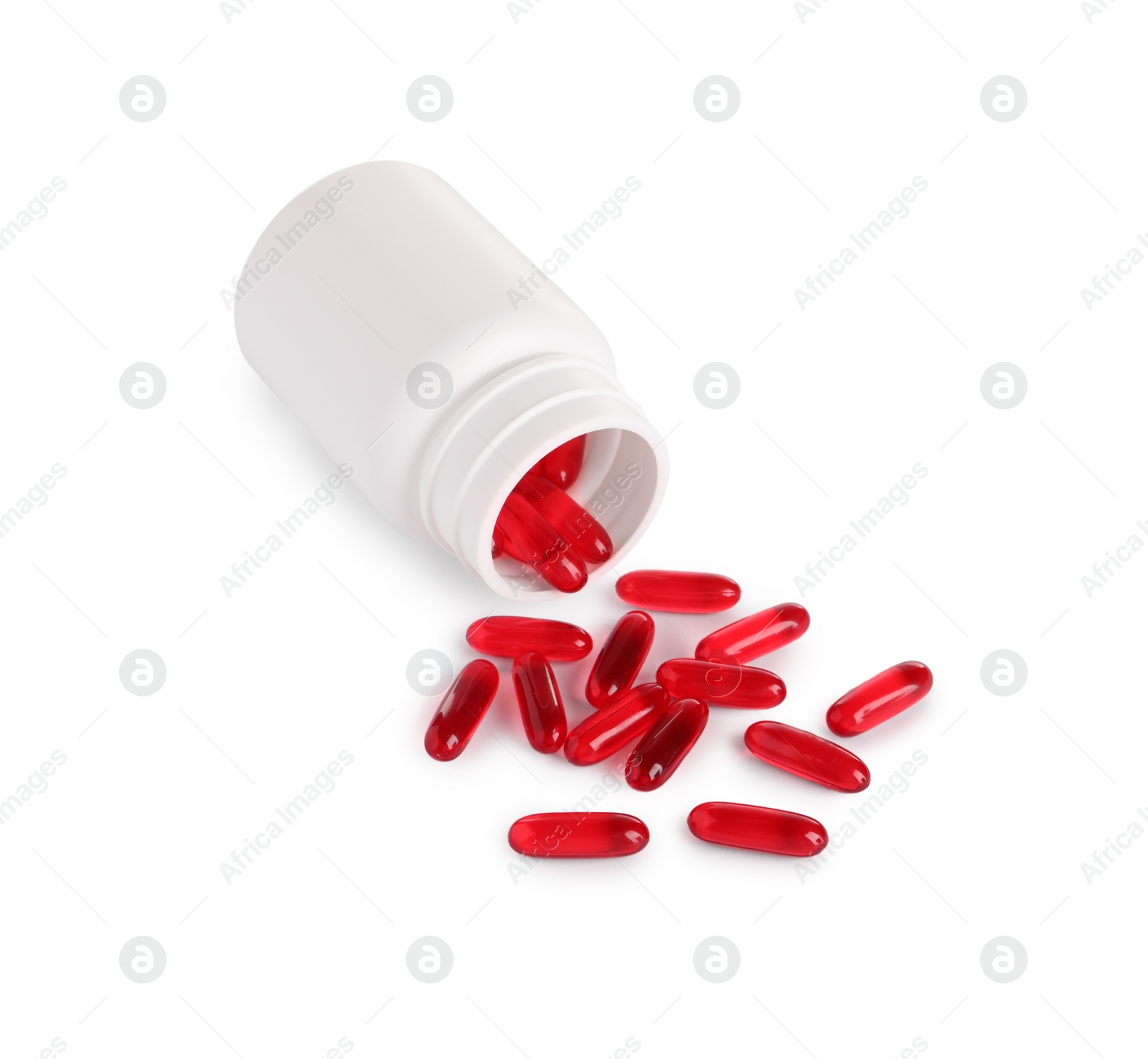 Photo of Plastic medical bottle with many red pills isolated on white