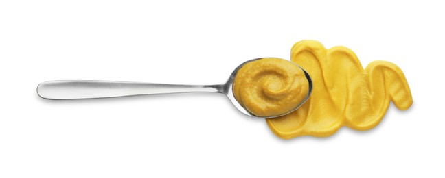 Photo of Fresh mustard sauce and spoon isolated on white, top view