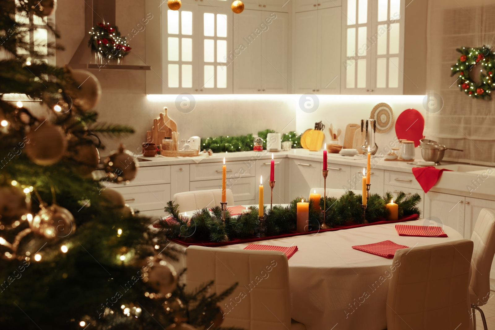 Photo of Cozy spacious kitchen decorated for Christmas. Interior design