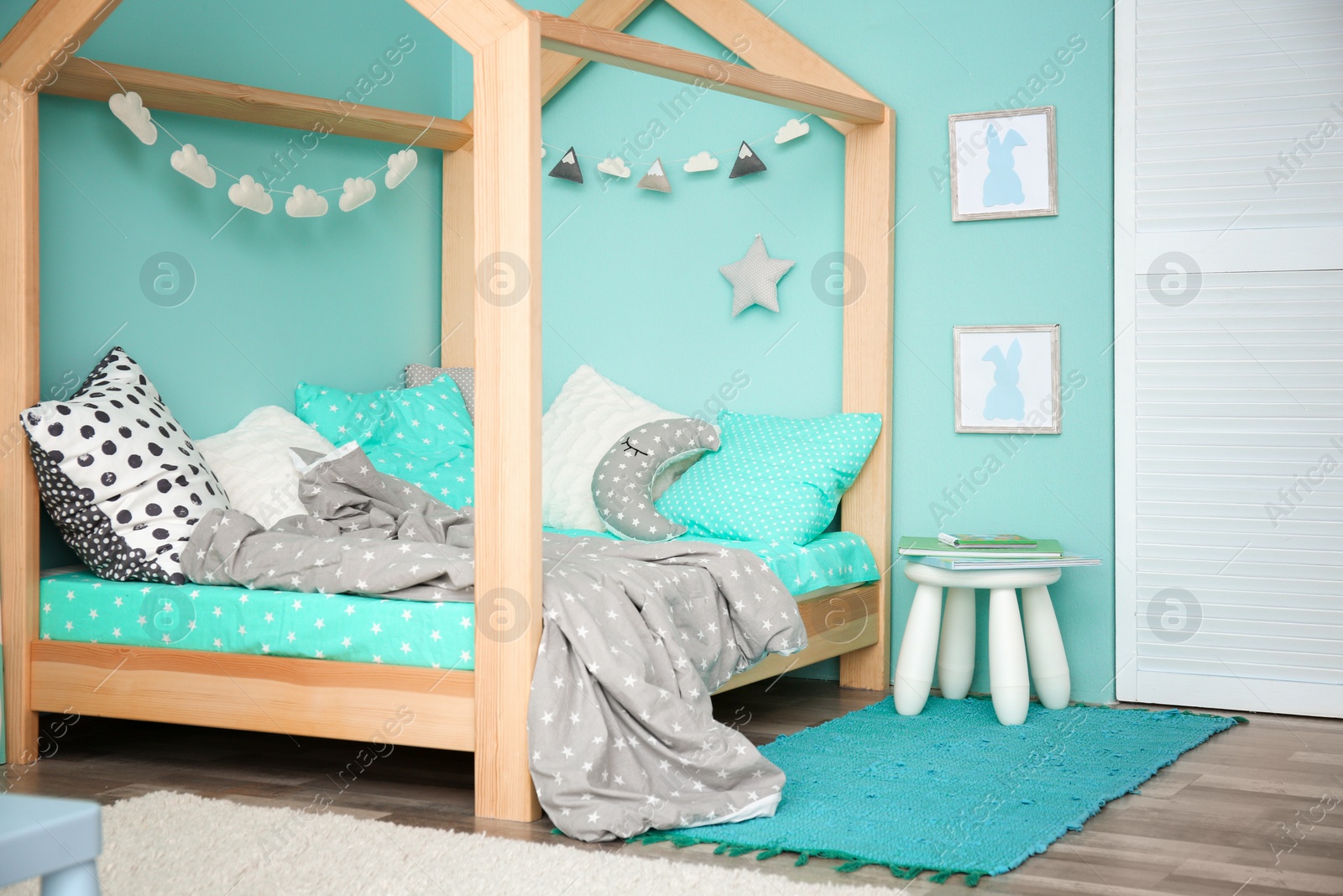 Photo of Comfortable bed in modern children room