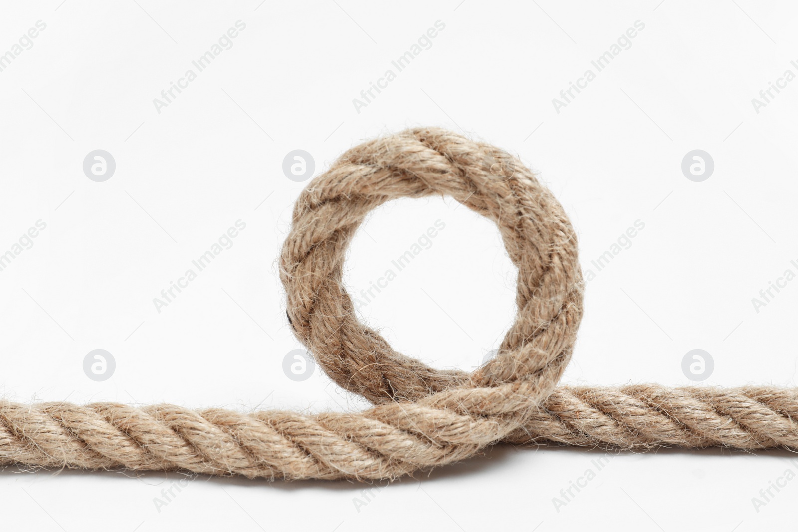 Photo of Loop made of cotton rope on white background