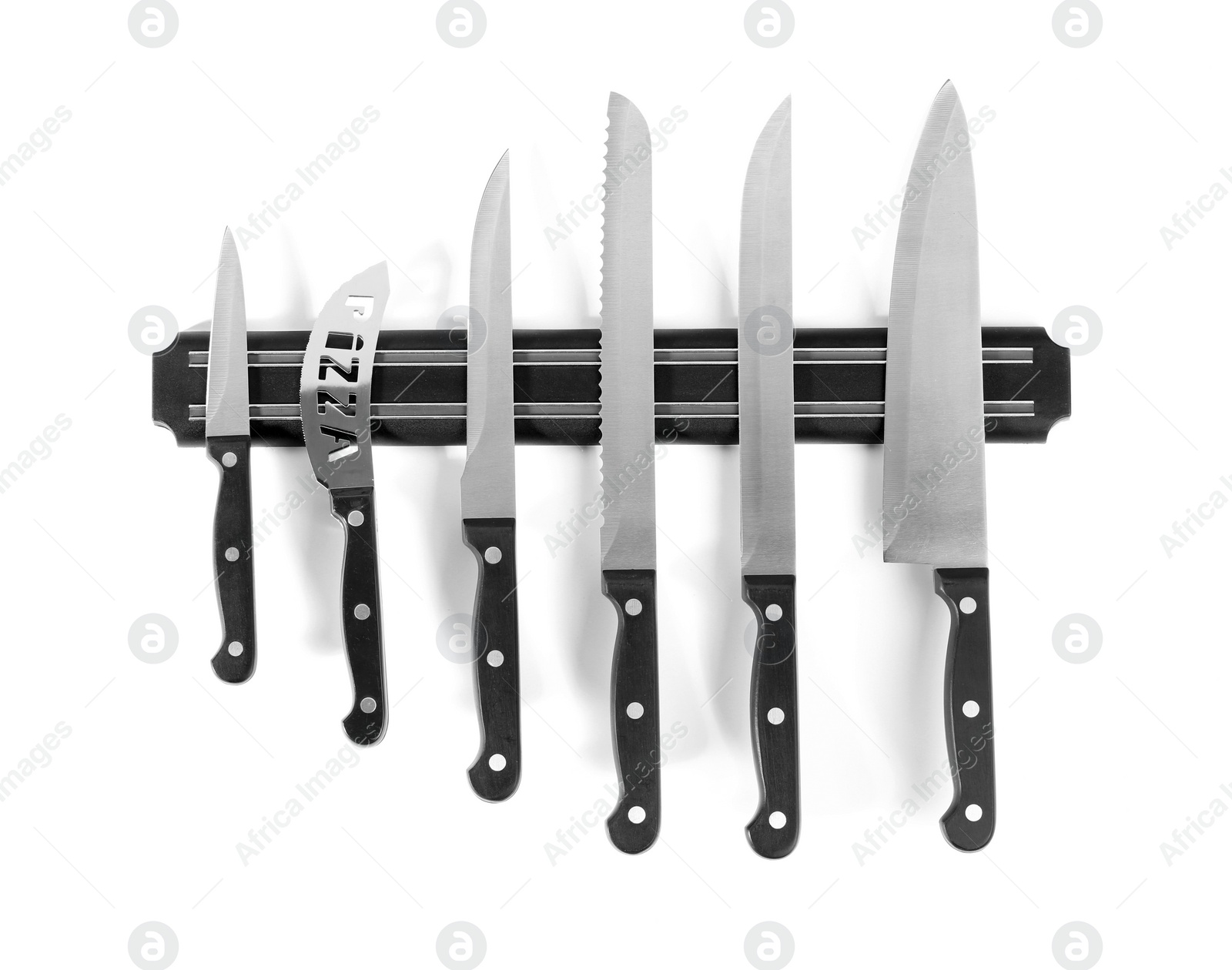 Photo of Magnetic holder with different knives isolated on white