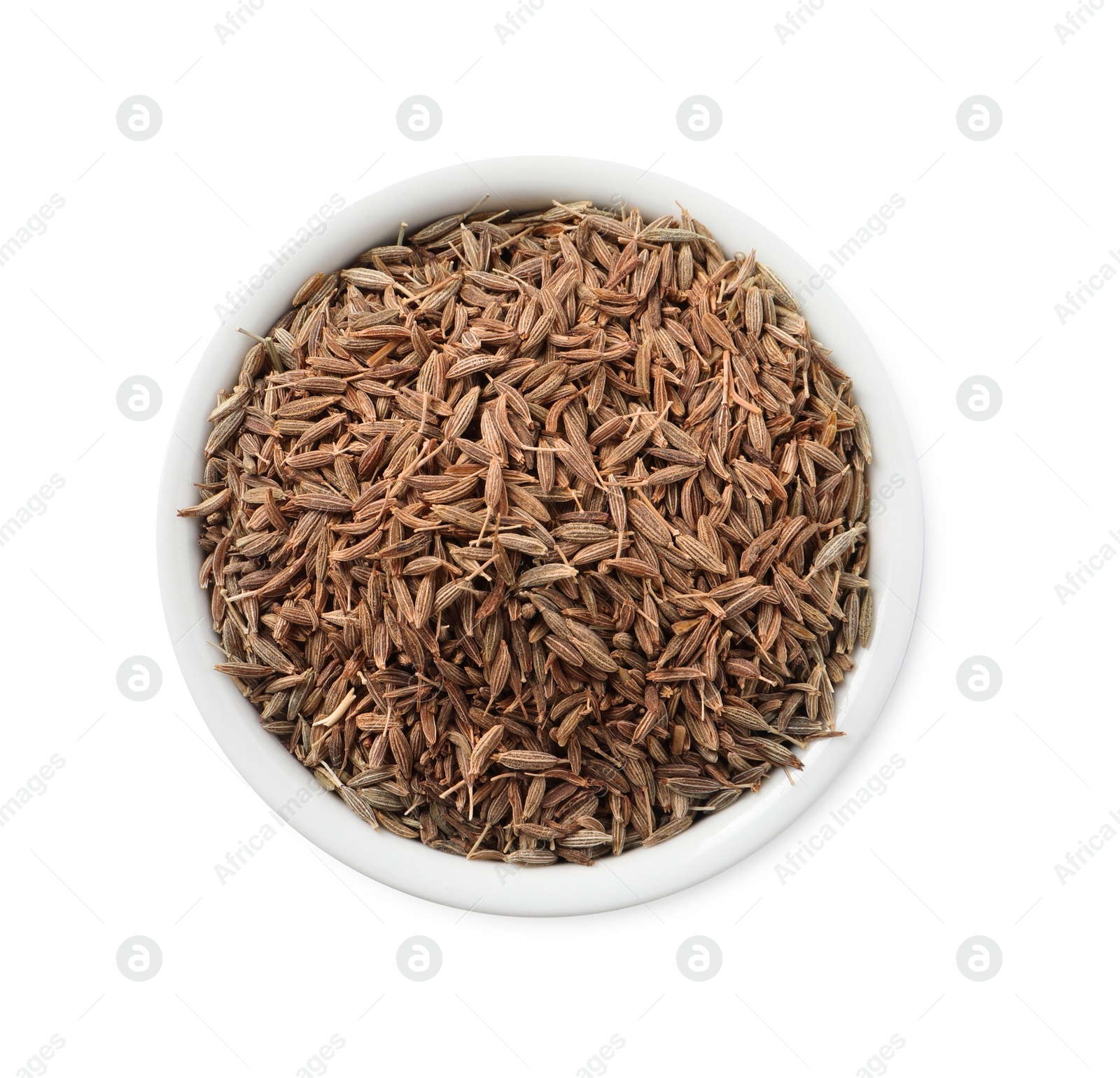 Photo of Bowl of aromatic caraway (Persian cumin) seeds isolated on white, top view