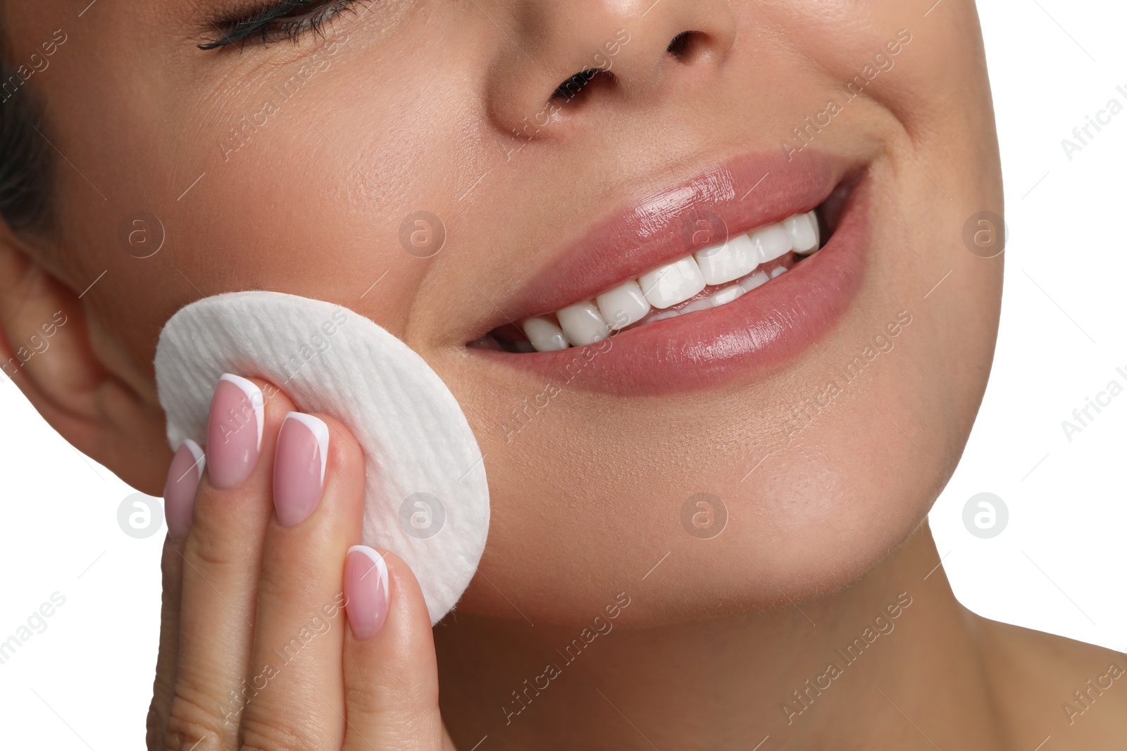 Photo of Beautiful woman removing makeup with cotton pad on white background, closeup