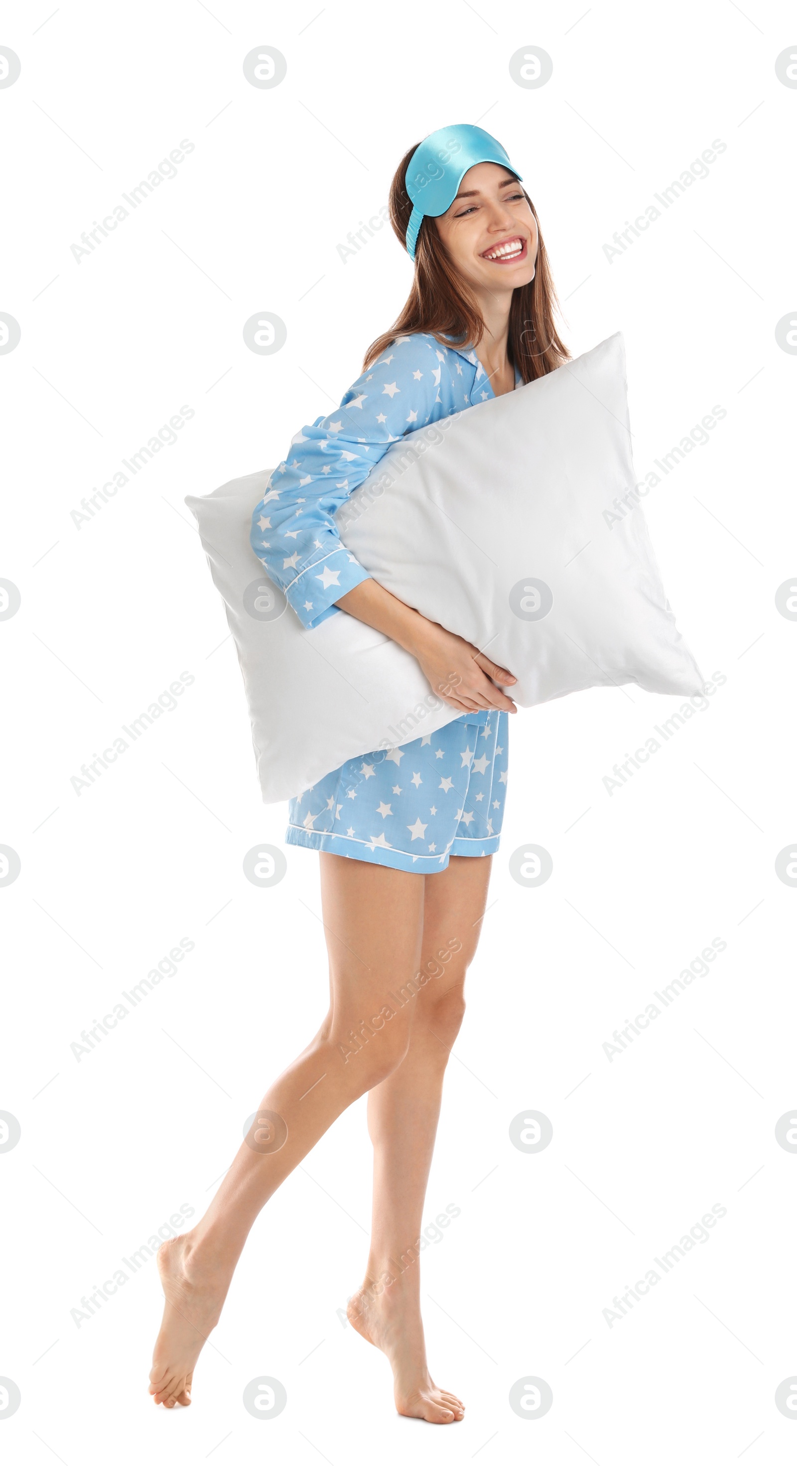 Photo of Beautiful woman with pillow and sleep mask on white background. Bedtime