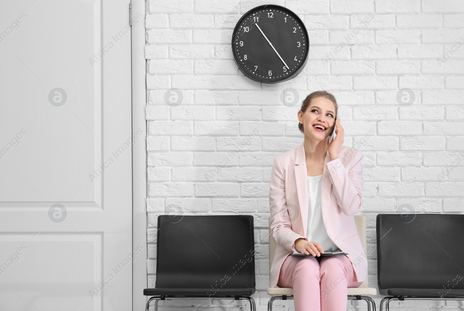 Photo of Young woman waiting for job interview, indoors