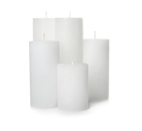Photo of Many scented wax candles on white background