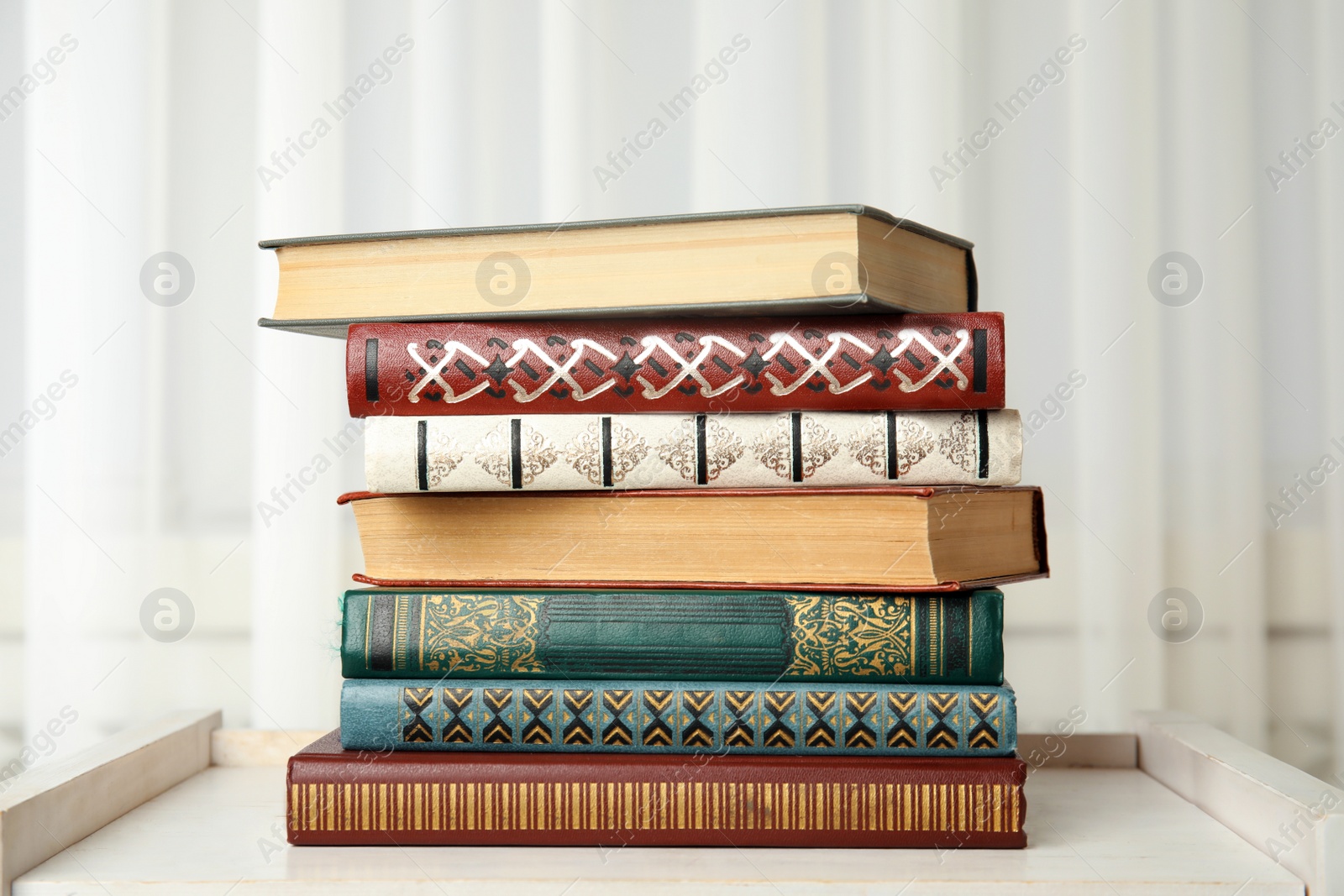 Photo of Collection of different books on table indoors